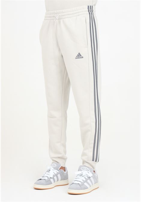 Pantalone sportivo Essentials French Terry Tapered Cuff 3-Stripes beige da uomo ADIDAS PERFORMANCE | JG5952.